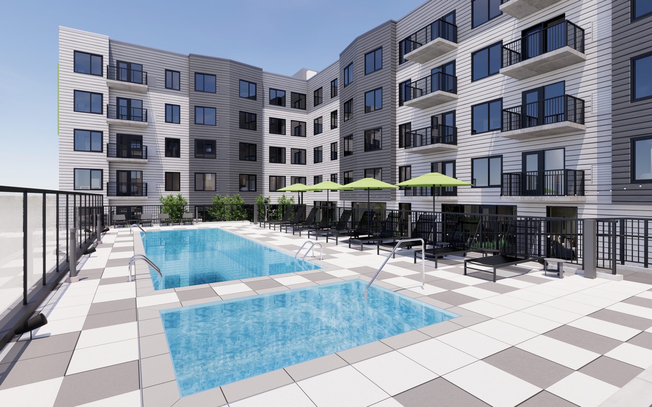 Outdoor pool area with sun loungers and umbrellas at Arlington Heights.